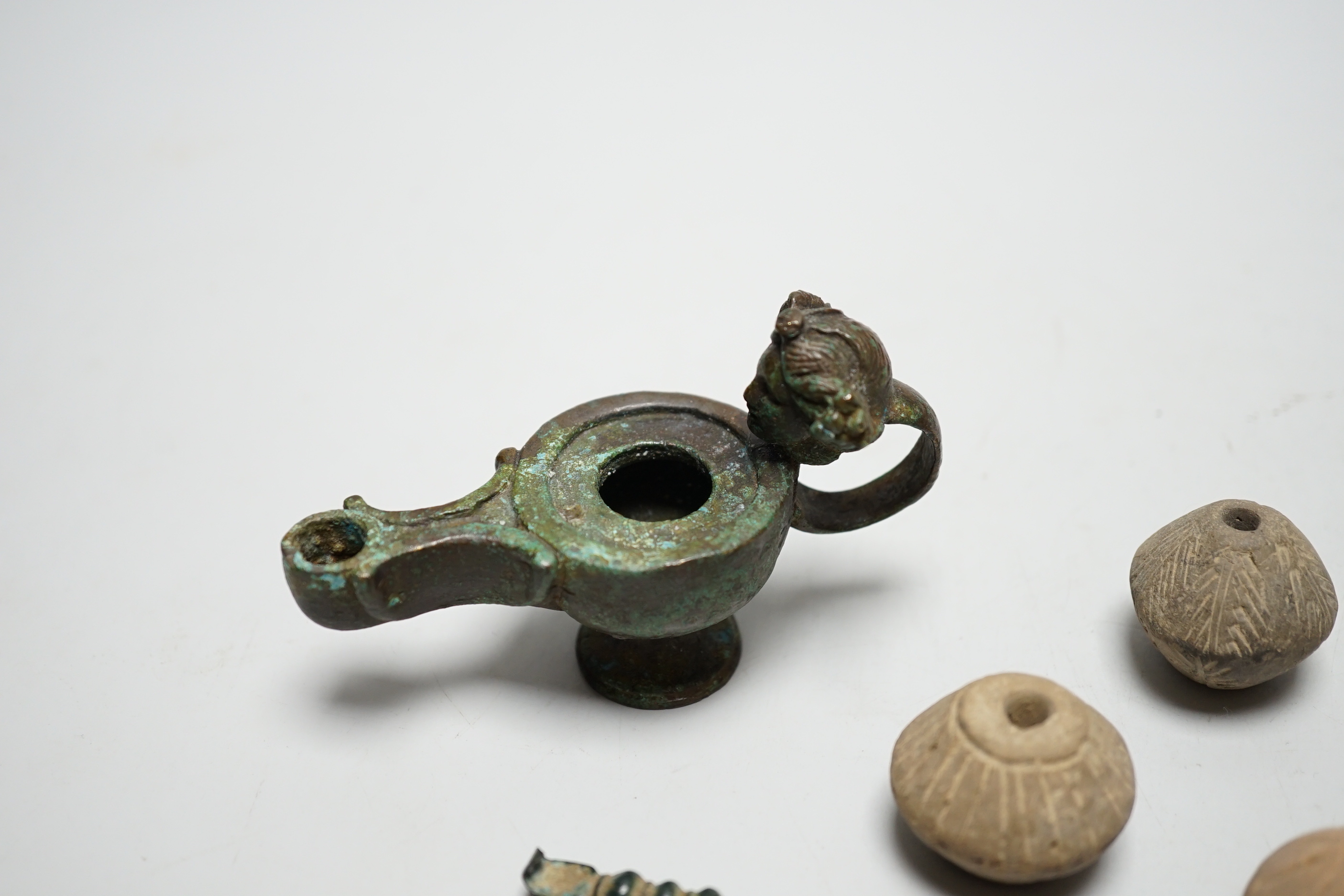 A collection of ancient bronze and terracotta items